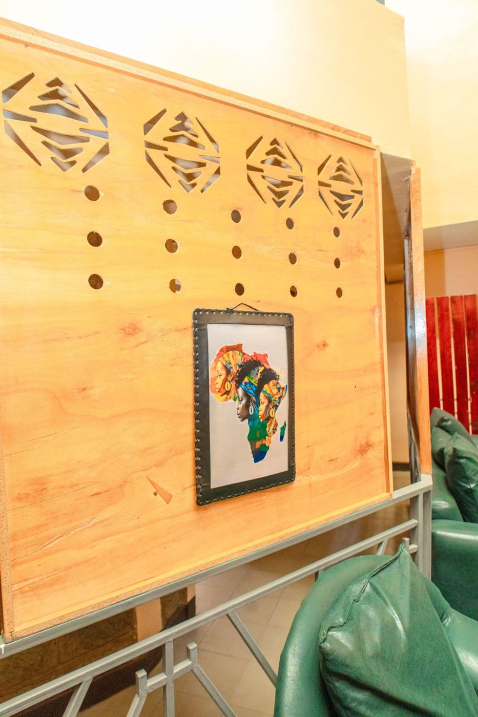 Carved wooden panel with African artwork