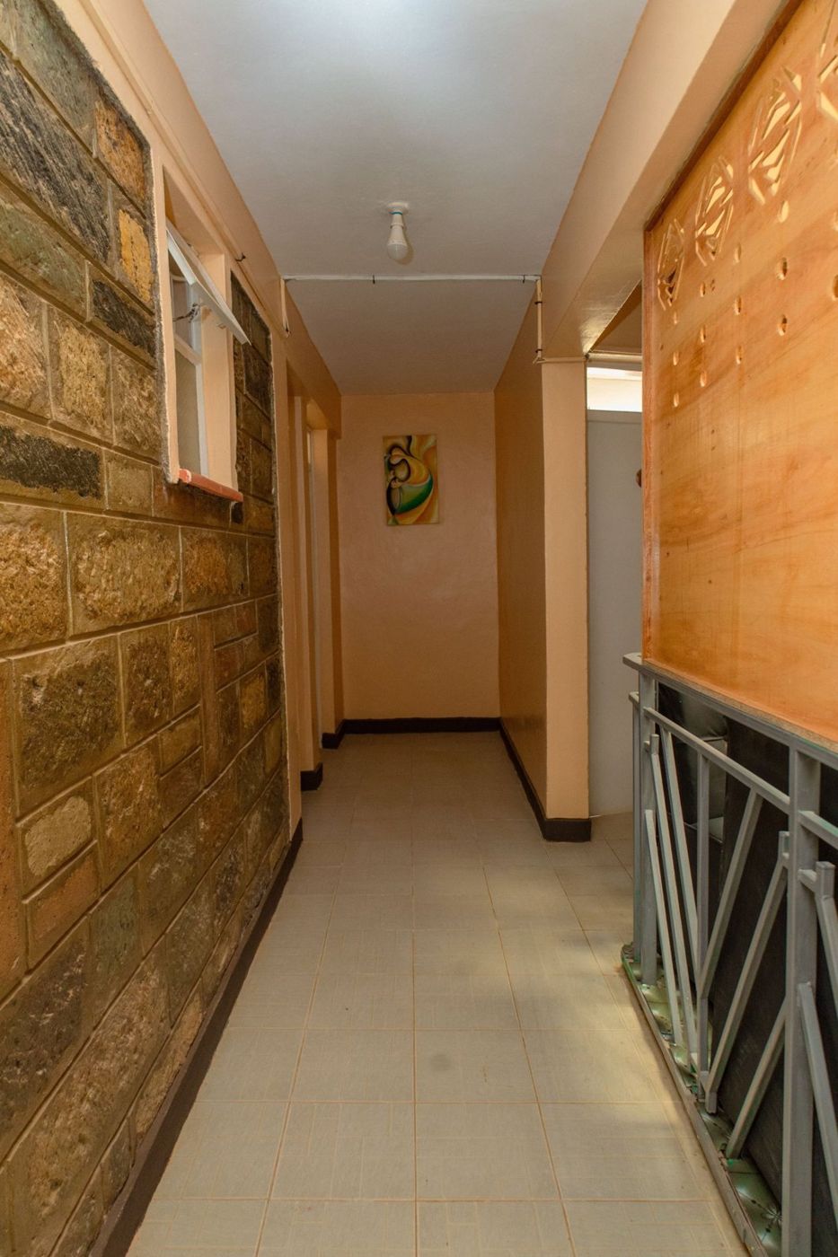 Clean corridor with a stone wall