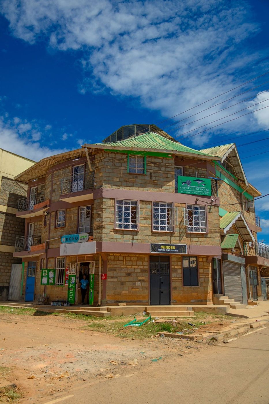 The NEDWE Guest House building on a sunny day in Mwanzo Estate, Eldoret